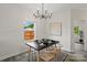 Modern dining area features stylish lighting, contemporary decor, and bright natural light from the window at 3092 Riker St, Clover, SC 29710