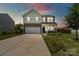 Charming two-story home with a well-manicured lawn and a welcoming front porch, perfect for enjoying the outdoors at 3092 Riker St, Clover, SC 29710