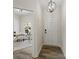 Bright foyer leads to an office featuring wood floors, white walls, and elegant lighting at 3092 Riker St, Clover, SC 29710