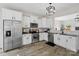 Bright kitchen featuring stainless steel appliances, white cabinets, and modern finishes at 3092 Riker St, Clover, SC 29710