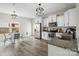 Modern kitchen featuring stainless steel appliances, white cabinets, and a dining area at 3092 Riker St, Clover, SC 29710