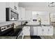 Modern kitchen with stainless steel appliances, granite countertops, and white subway tile backsplash at 3092 Riker St, Clover, SC 29710
