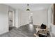 Open-concept living area with sleek flooring, modern decor, and plenty of natural light at 3092 Riker St, Clover, SC 29710