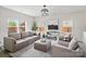 Bright and airy living room with neutral furniture, hardwood floors, and large windows for ample light at 3092 Riker St, Clover, SC 29710