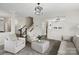 Open-concept living area featuring a staircase, modern light fixtures, and comfortable seating at 3092 Riker St, Clover, SC 29710