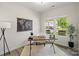 Bright home office with a work desk, floor lamp, rug, and a view of the outdoors at 3092 Riker St, Clover, SC 29710