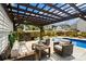Inviting outdoor space includes a covered pergola, outdoor seating, and a sparkling pool at 3092 Riker St, Clover, SC 29710