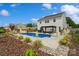 Relaxing backyard pool area features a manicured landscape, wood fence, pergola and playground at 3092 Riker St, Clover, SC 29710