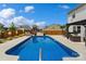Stunning backyard pool area with a slide, a pergola, and lounge chairs, perfect for summer relaxation and entertainment at 3092 Riker St, Clover, SC 29710