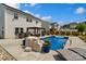 Backyard showcasing a pristine pool, a modern pergola, and comfortable lounge furniture, perfect for relaxation and gatherings at 3092 Riker St, Clover, SC 29710