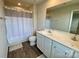 Well-lit bathroom featuring a double sink vanity with a shower and tub at 3113 Bouquet St, Charlotte, NC 28215