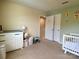 Comfortable Bedroom with changing table, crib, and playful decor, creating a warm atmosphere at 3113 Bouquet St, Charlotte, NC 28215
