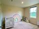 Cozy Bedroom with a crib, charming wall art, and ample natural light from the window at 3113 Bouquet St, Charlotte, NC 28215