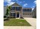 Charming two-story home featuring a well-maintained lawn and a two-car garage at 3113 Bouquet St, Charlotte, NC 28215
