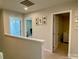 Upstairs hallway featuring carpet and views into rooms with doors and wall decor at 3113 Bouquet St, Charlotte, NC 28215