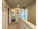 Upper hallway showcasing carpeted floor, natural light, and entryways to bedrooms and bathrooms at 3113 Bouquet St, Charlotte, NC 28215