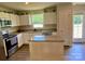 Eat-in kitchen features stainless appliances, modern cabinets, and granite countertops at 3113 Bouquet St, Charlotte, NC 28215