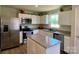 Eat-in kitchen features stainless appliances, modern cabinets, and granite countertops at 3113 Bouquet St, Charlotte, NC 28215