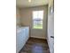 Efficient laundry room with a washing machine, dryer, and a window for natural light at 3113 Bouquet St, Charlotte, NC 28215