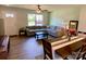 Inviting living room and dining area with wood-look floors and a modern ceiling fan at 3113 Bouquet St, Charlotte, NC 28215