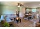 Inviting living room and dining area with wood-look floors and a modern ceiling fan at 3113 Bouquet St, Charlotte, NC 28215