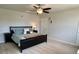 Main bedroom with a dark wood frame bed, neutral walls, and carpeted floor at 3113 Bouquet St, Charlotte, NC 28215