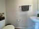 Cozy powder room with neutral paint, pedestal sink, and gray hand towel at 3113 Bouquet St, Charlotte, NC 28215