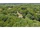 High aerial perspective of a wooded property featuring mature trees and a house at 312 Walton Dr, Statesville, NC 28625