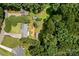 Aerial view of the property showcasing the house, backyard, and surrounding greenery at 312 Walton Dr, Statesville, NC 28625