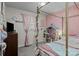 Charming bedroom with pink accents, a canopy bed, and lots of natural light at 312 Walton Dr, Statesville, NC 28625