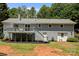 Grey two-story home showing a deck and access to the backyard at 312 Walton Dr, Statesville, NC 28625