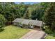 Well-maintained single-story home featuring a lovely front lawn, covered entry, and convenient carport at 312 Walton Dr, Statesville, NC 28625