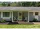 Inviting front porch with charming decor, seating, and stylish details for a warm welcome at 312 Walton Dr, Statesville, NC 28625