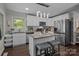 Modern kitchen with a center island, stainless steel appliances, and stylish pendant lighting at 312 Walton Dr, Statesville, NC 28625