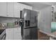 Kitchen with stainless steel appliances, granite countertops, and white cabinets at 312 Walton Dr, Statesville, NC 28625