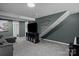 Spacious entertainment area with a large TV and modern shelving at 312 Walton Dr, Statesville, NC 28625