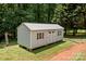 Backyard storage shed with double doors and decorative shutters at 312 Walton Dr, Statesville, NC 28625