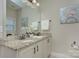 Bathroom vanity with double sinks, granite countertops, and classic white cabinetry at 317 Annatto Way, Tega Cay, SC 29708