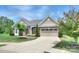 Beautiful home featuring brick accents, a well-maintained lawn, and a spacious driveway at 317 Annatto Way, Tega Cay, SC 29708