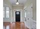 Elegant foyer featuring hardwood floors, arched doorways, and natural light at 317 Annatto Way, Tega Cay, SC 29708