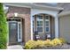 Inviting front porch with rocking chairs and decorative pillows at 317 Annatto Way, Tega Cay, SC 29708