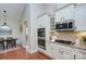 Updated kitchen with stainless steel appliances and granite countertops at 317 Annatto Way, Tega Cay, SC 29708