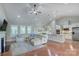 Open living room with hardwood floors, natural light, and stylish decor at 317 Annatto Way, Tega Cay, SC 29708