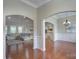 Open-concept living spaces with hardwood floors, arched entryways, and plenty of natural light at 317 Annatto Way, Tega Cay, SC 29708