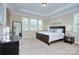 Spacious main bedroom with tray ceilings and natural light at 317 Annatto Way, Tega Cay, SC 29708