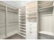 Organized walk-in closet featuring lots of shelving and rod space at 317 Annatto Way, Tega Cay, SC 29708