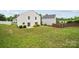 Expansive backyard featuring lush grass, patio space, and privacy fencing at 3512 Gibbon Terrace Ct, Charlotte, NC 28269