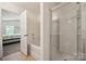 Bright bathroom featuring shower, tub, and seamless layout to the bedroom with easy accessibility at 3512 Gibbon Terrace Ct, Charlotte, NC 28269