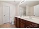 Bathroom featuring double sink, vanity, and tile flooring, with a separate toilet area for added privacy at 3512 Gibbon Terrace Ct, Charlotte, NC 28269