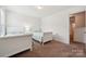 Inviting bedroom with twin beds, carpet, and a large doorway to a closet space at 3512 Gibbon Terrace Ct, Charlotte, NC 28269